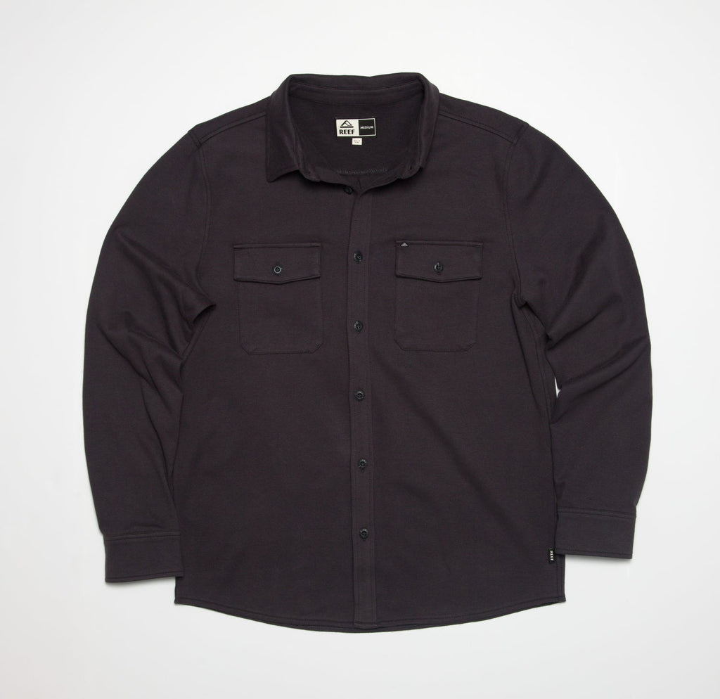Front view of the Raymond Ls Shirt in dark fabric, featuring button closures and dual chest pockets.
