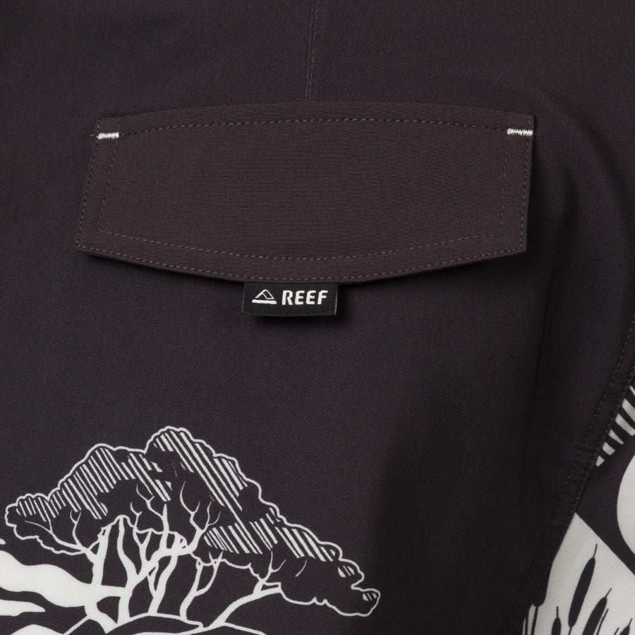 Close-up of the back pocket on the Marshall Boardshort showing water-friendly fabric and REEF branding tag.