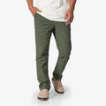 Men wearing Matthew Twill Pant in olive green, with beige shoes facing forward, showcasing comfort and casual style.
