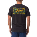 Rear view of a man wearing a black Isac Tee with colorful Reef logo graphic, surf-inspired and comfort focused design.