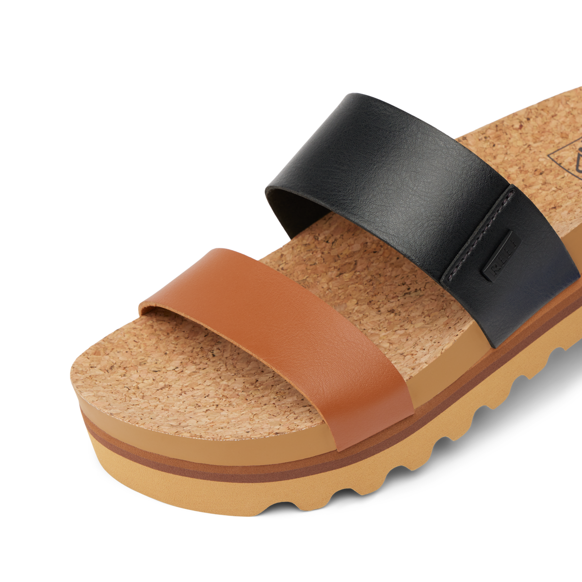 Close-up of Cushion Vista Hi sandal facing right, showing cork footbed and dual black and brown straps for comfort.