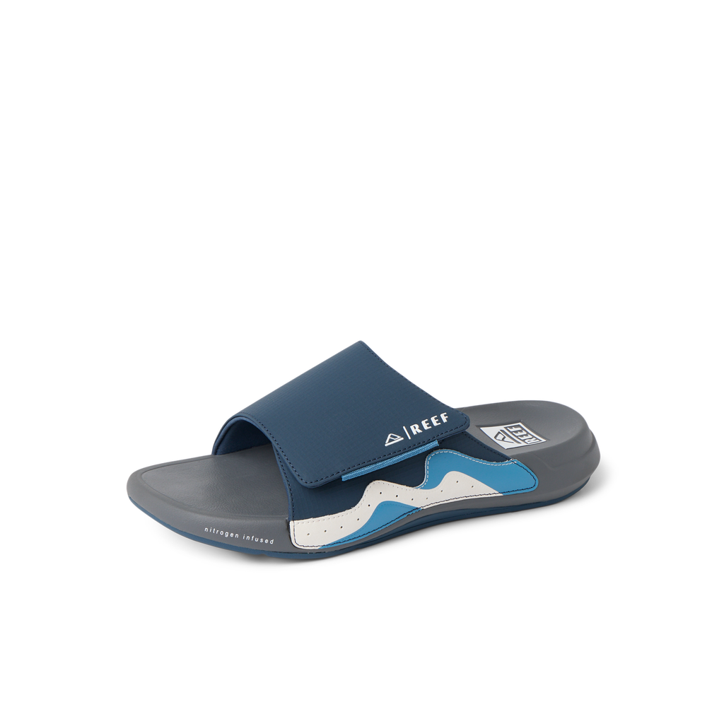 Cruiser Slide facing left, navy grey white men's slide sandal with anatomical arch support and cushioned footbed.