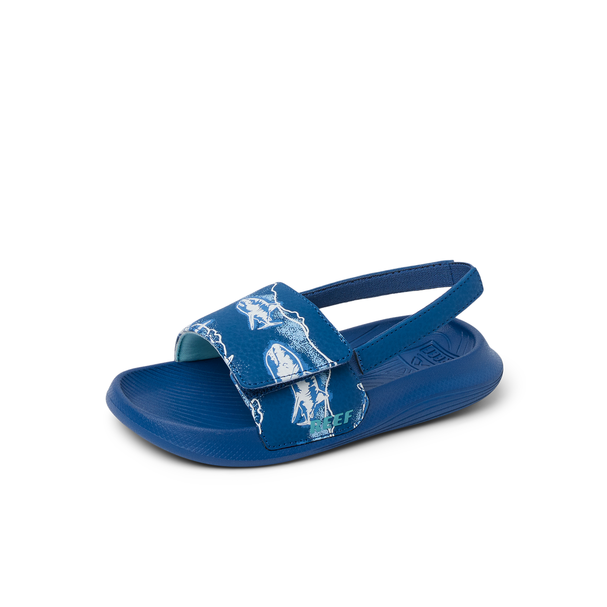 Little Salty Slide sandal facing left showing top and side with adjustable strap, cushioned footbed, and surf-inspired design.