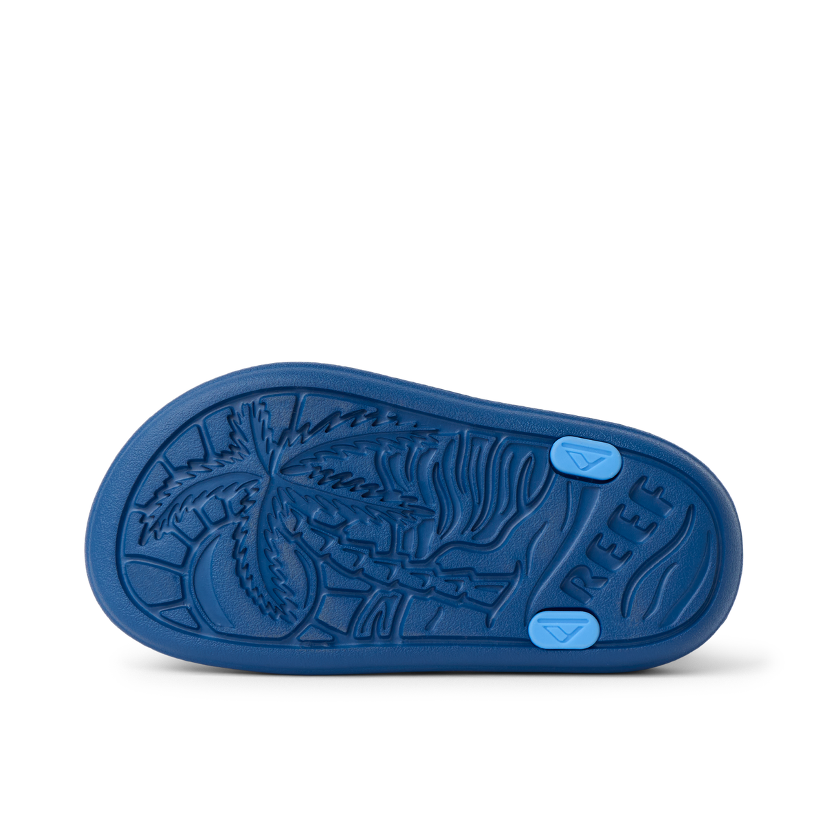 Little Totally Beachin shoe sole facing up showing palm tree design and REEF logo with durable, water-friendly comfort features.