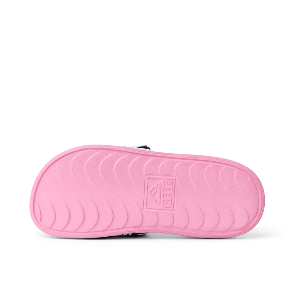 Kids Salty Slide right sandal sole in pink, showing molded footbed with anatomical arch support and durable texture
