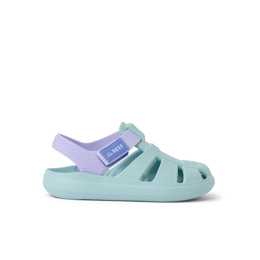 Little Totally Beachin left-facing girls' sandal in pastel blue and purple, surf-inspired comfort with arch support and cushioning.