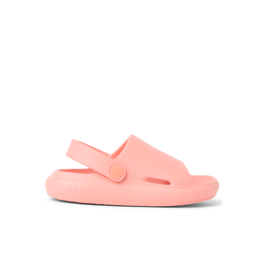 Little Rio Slide coral kids' sandal facing right showing side profile with cushioned sole and supportive strap.