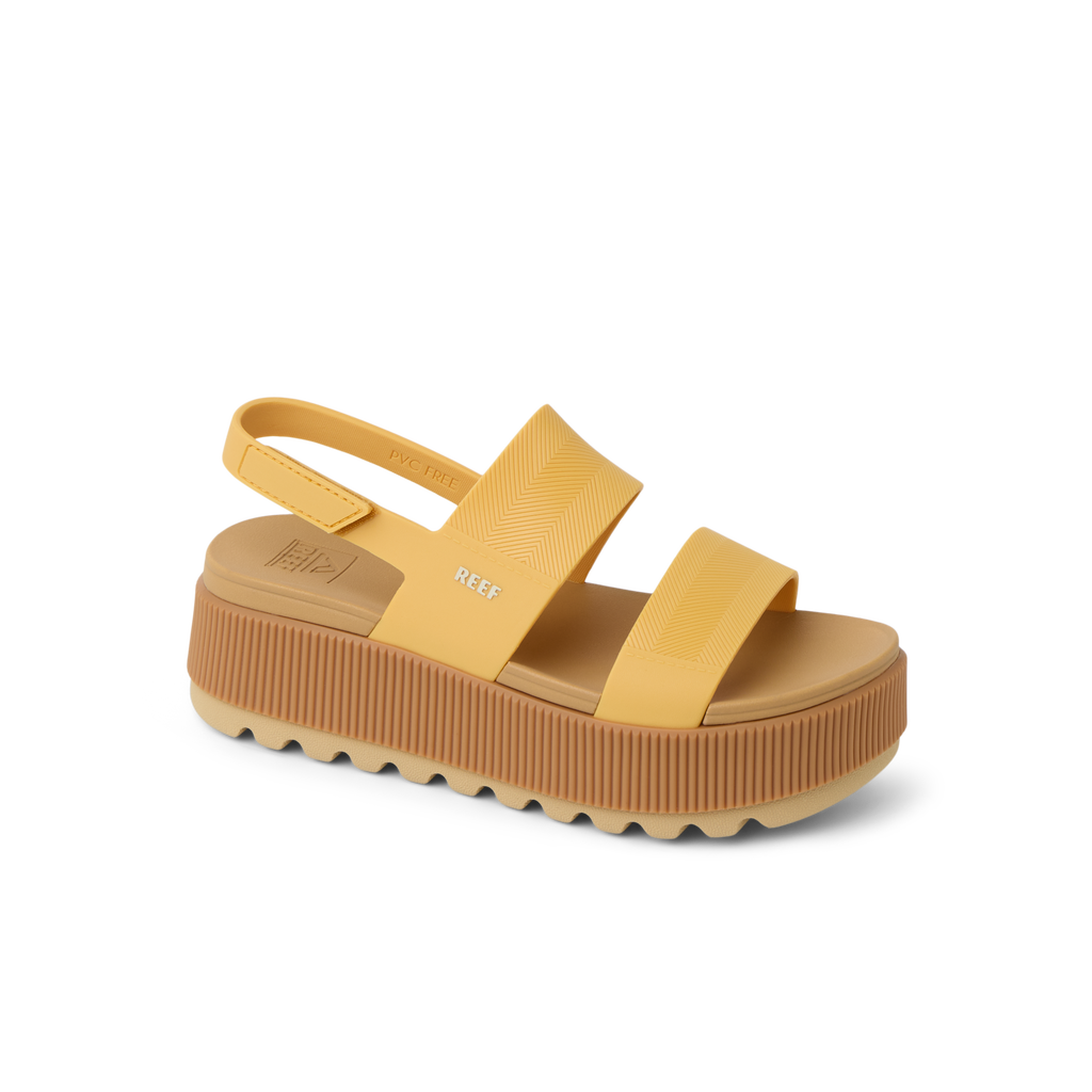 Water Vista Higher sandal facing left, close-up of golden apricot platform with anatomical arch support and soft cushioning.