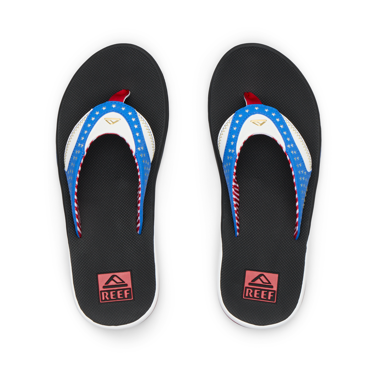 Pair of Fanning men's flip flops facing upward, featuring American flag design straps and cushioned soles for beach comfort.