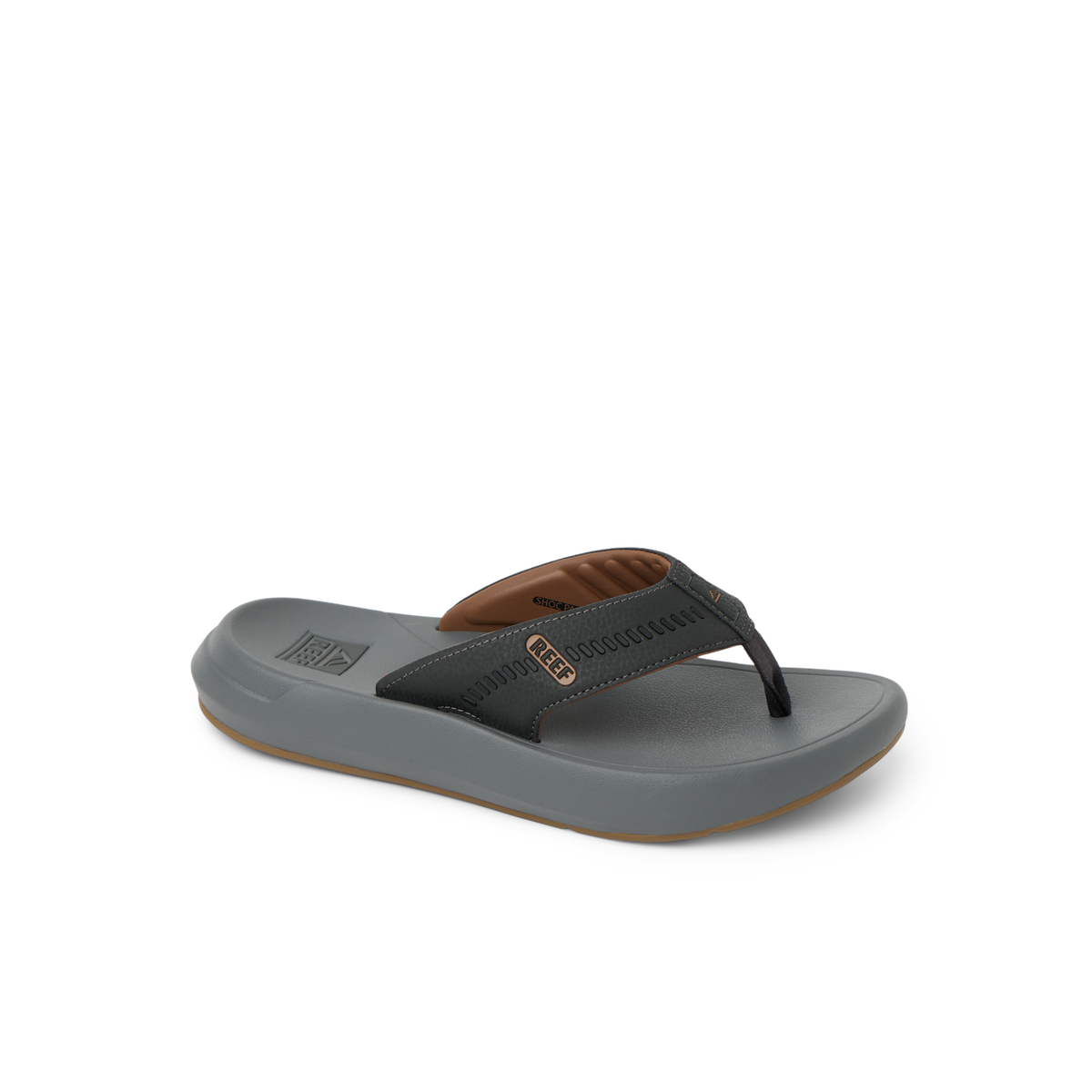 Cruiser men's sandal facing right, with brown and black straps, showing toe post and cushioned footbed for beach comfort.