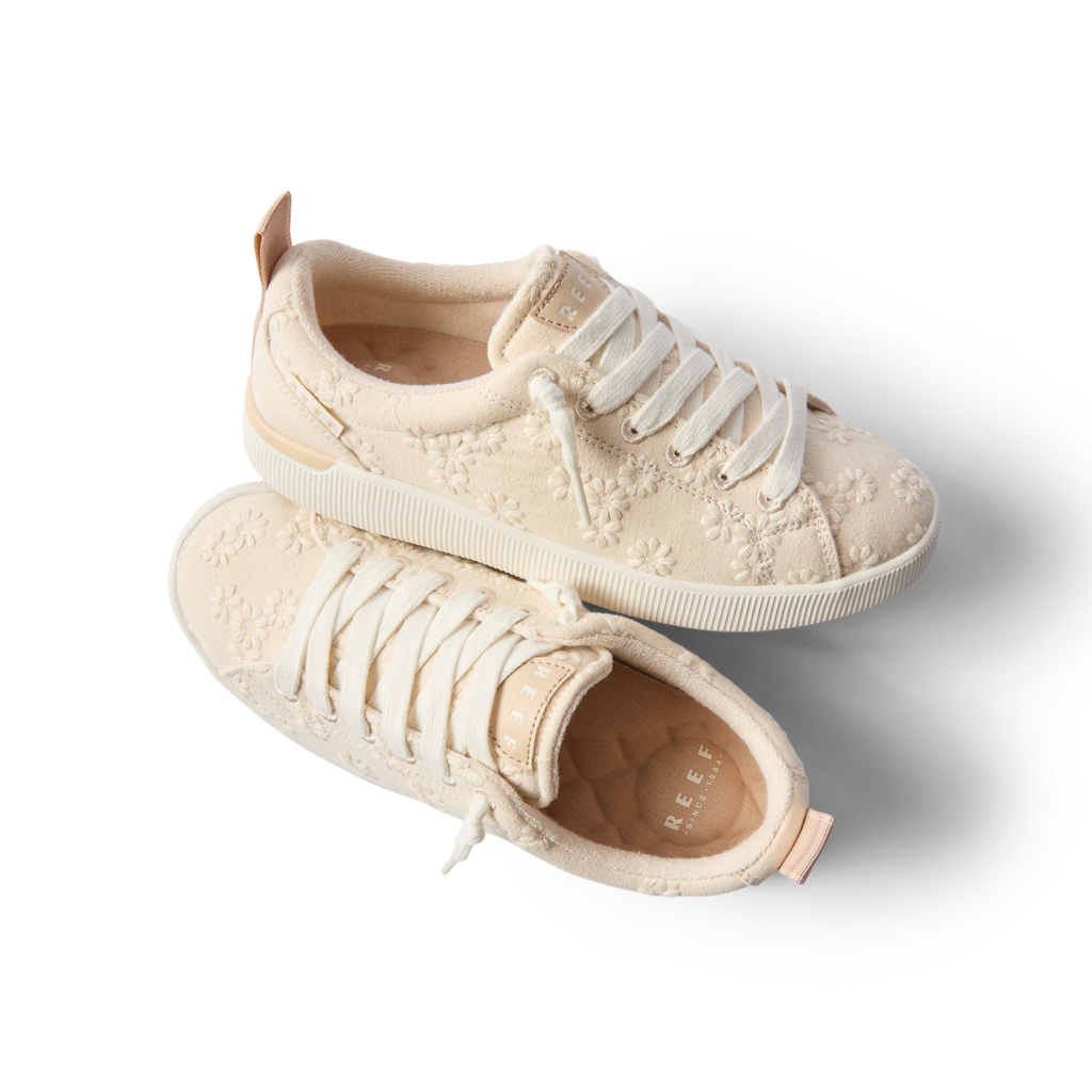 Neptune Alana women's sneakers in light floral fabric, right shoe side view, left shoe top view, beach-inspired comfort design.