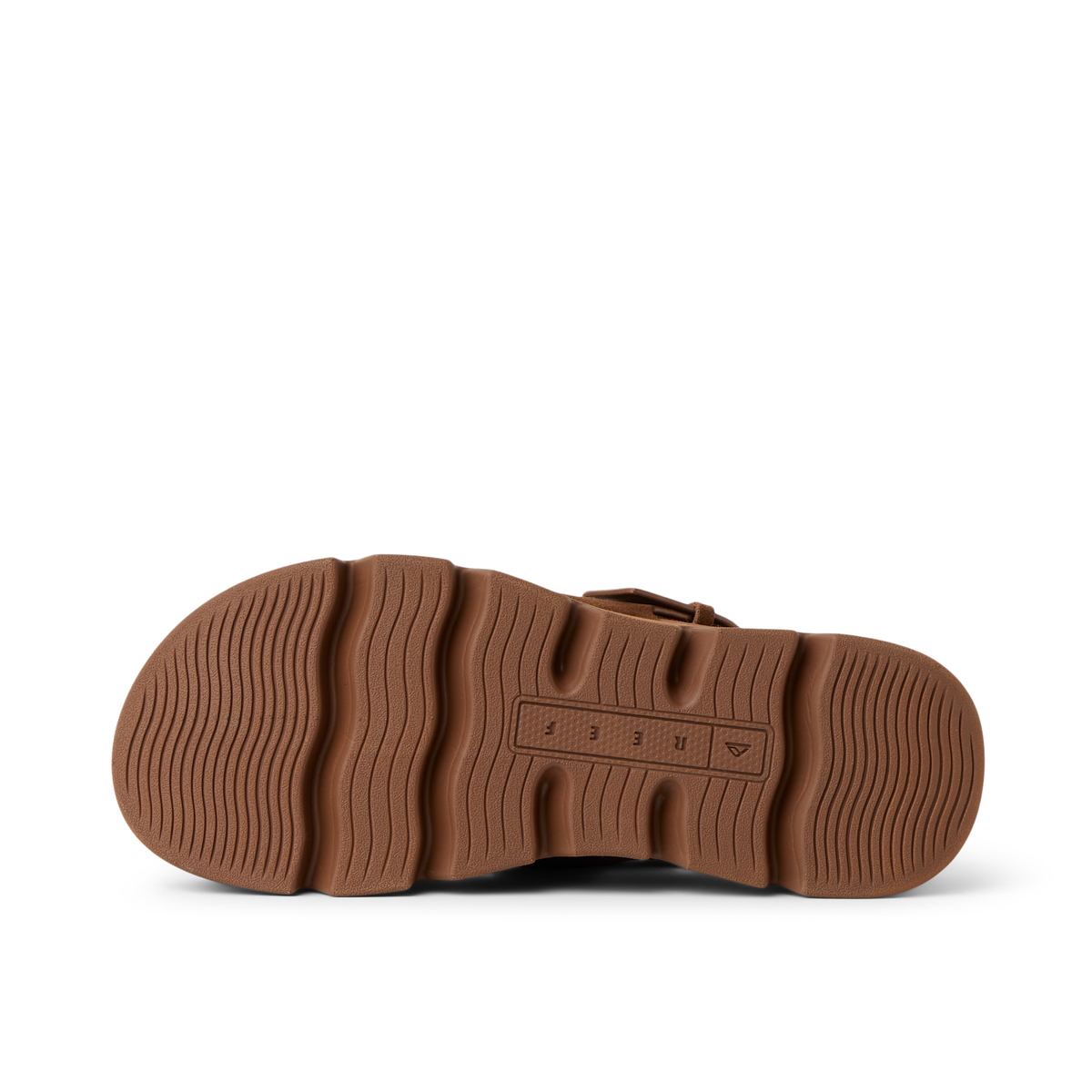 Vista Luxe Liah outsole facing up, brown rubber sole with wave-inspired tread for durable beach-ready traction and comfort