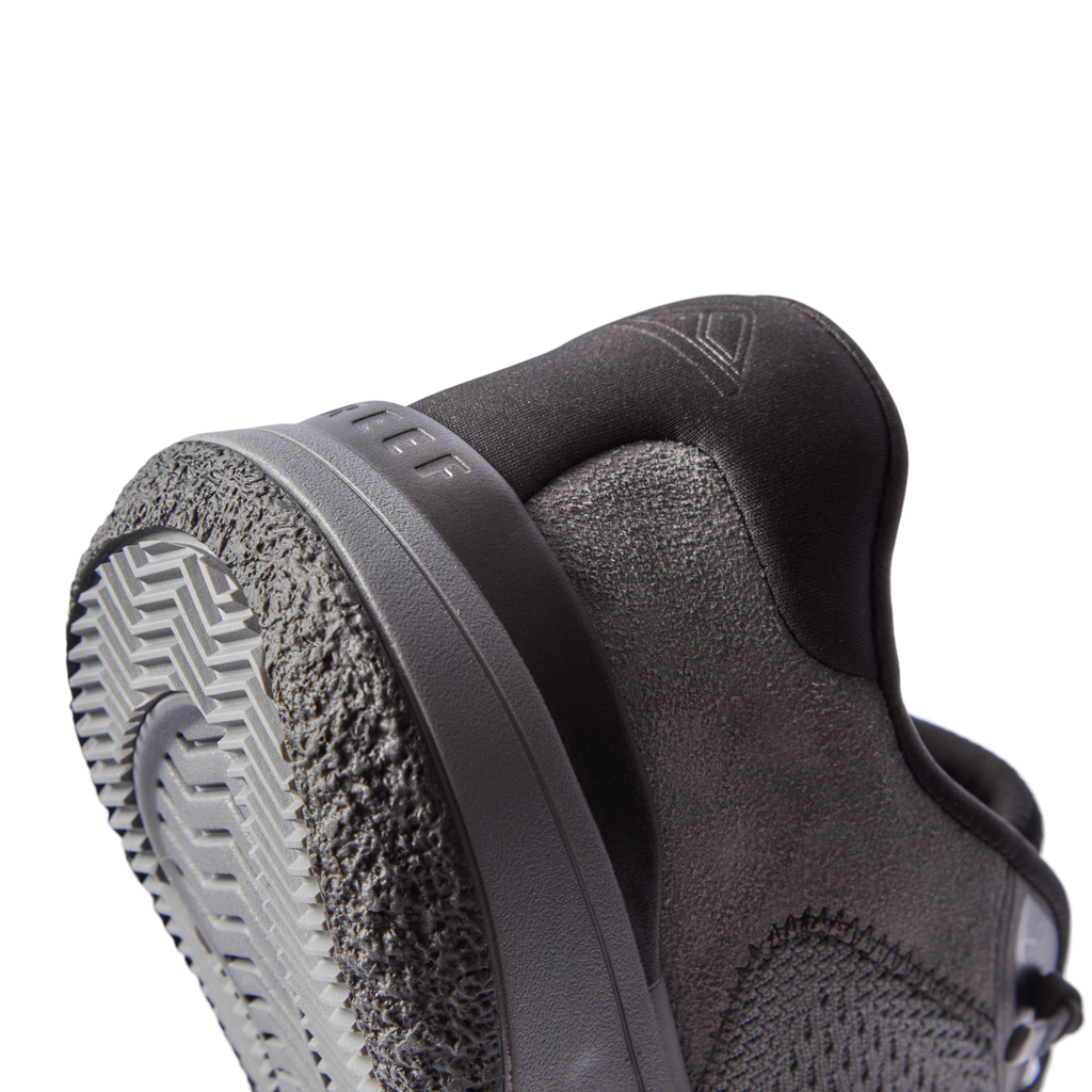 Close-up of the Shoreline Del Mar shoe heel facing left, featuring grey sustainable materials and REEF comfort technology.