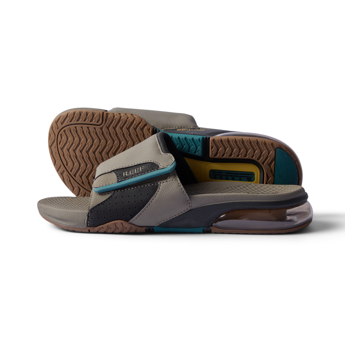 Close-up of tan and spruce slides facing right showing cushioned footbed, textured sole, and anatomical arch support design