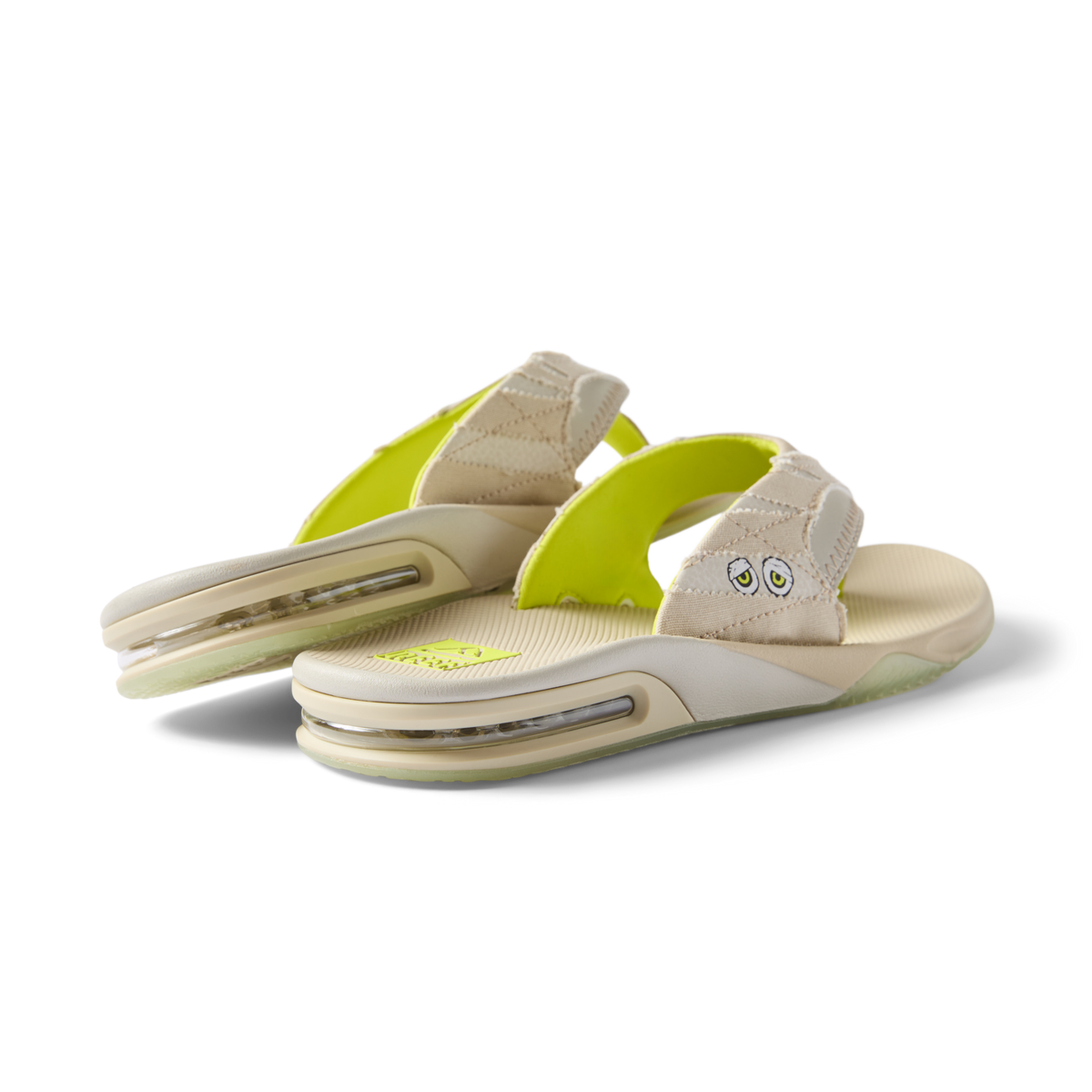 Pair of beige Fanning sandals facing right showing heel and cushioned arch support, designed for beach comfort and durability.