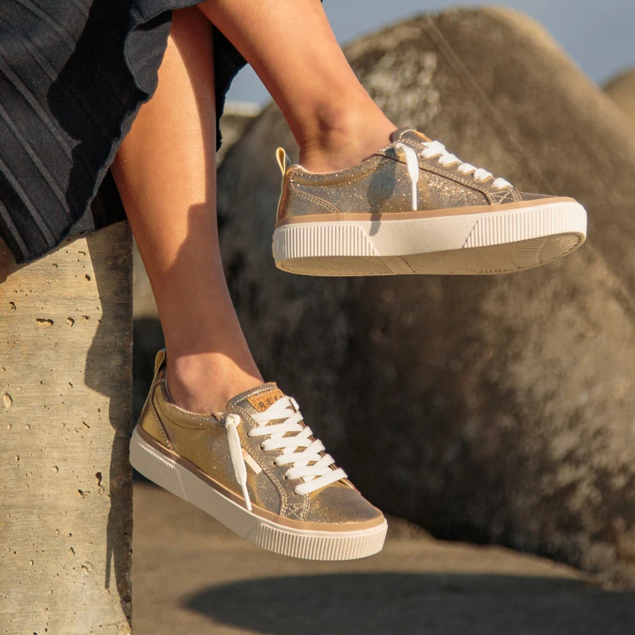 Side view of Lay Day Dawn women's sneakers with white laces, highlighting comfortable, surf-inspired design and durable sole.