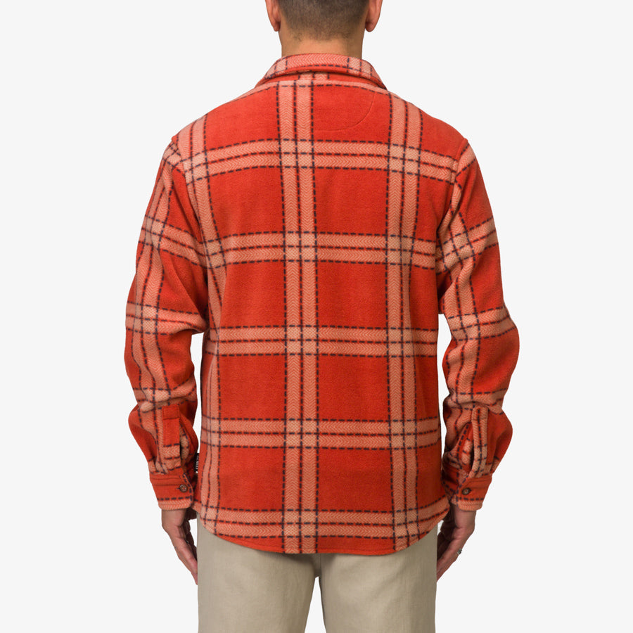 Back view of men’s Karter Shirt Jacket in cinnabar orange plaid, surf-inspired comfort and durable fabric design.