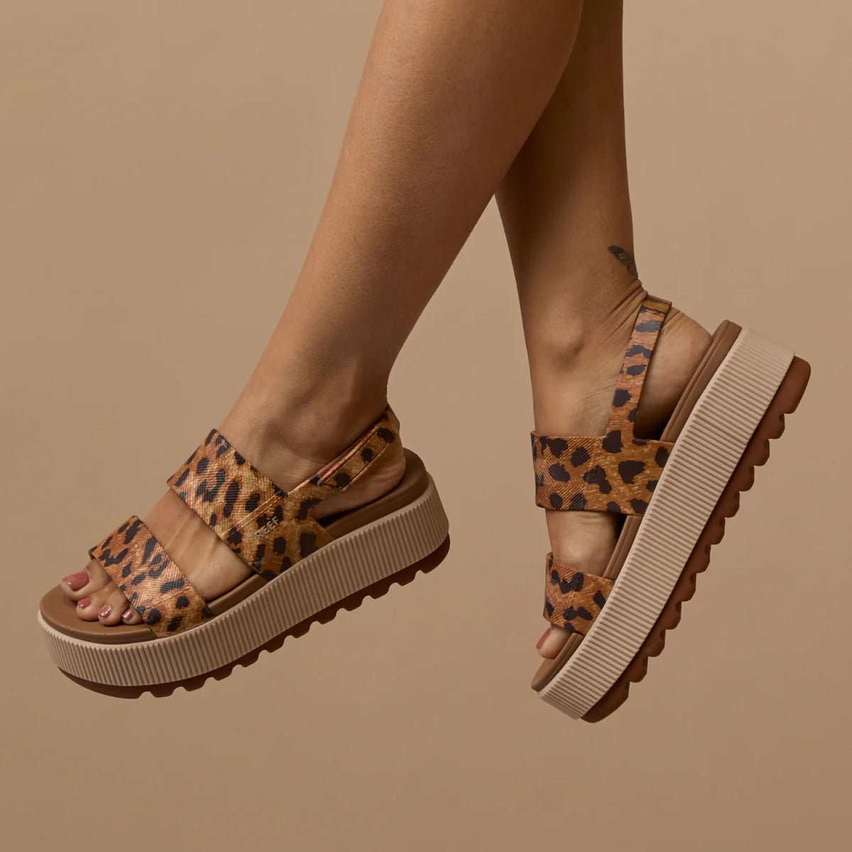 Side view of Women's Water Vista Higher sandals in leopard print with cushioned platform and anatomical arch support