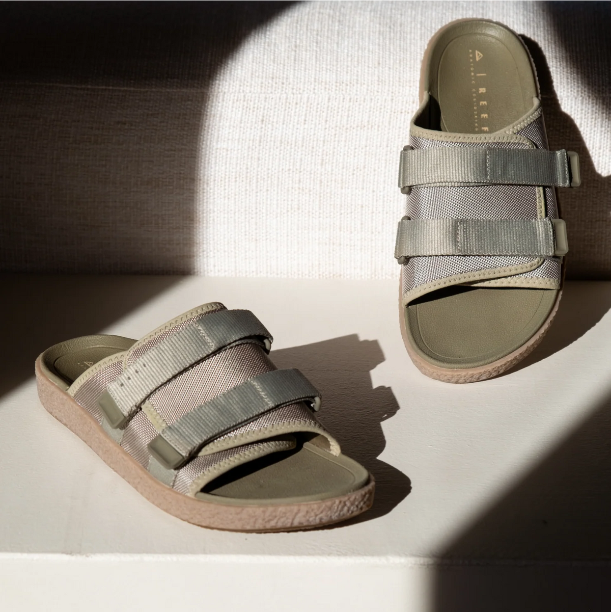 Montauk sandals in sage facing right and left, showing straps and cushioned arch support, surf-inspired comfort design.