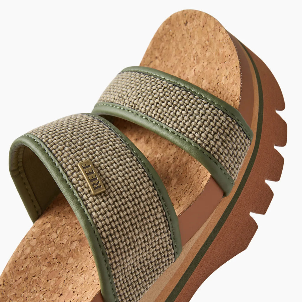 Close-up of Cushion Vista Higher sandal facing right with cushioned arch support and woven fabric straps in forest green