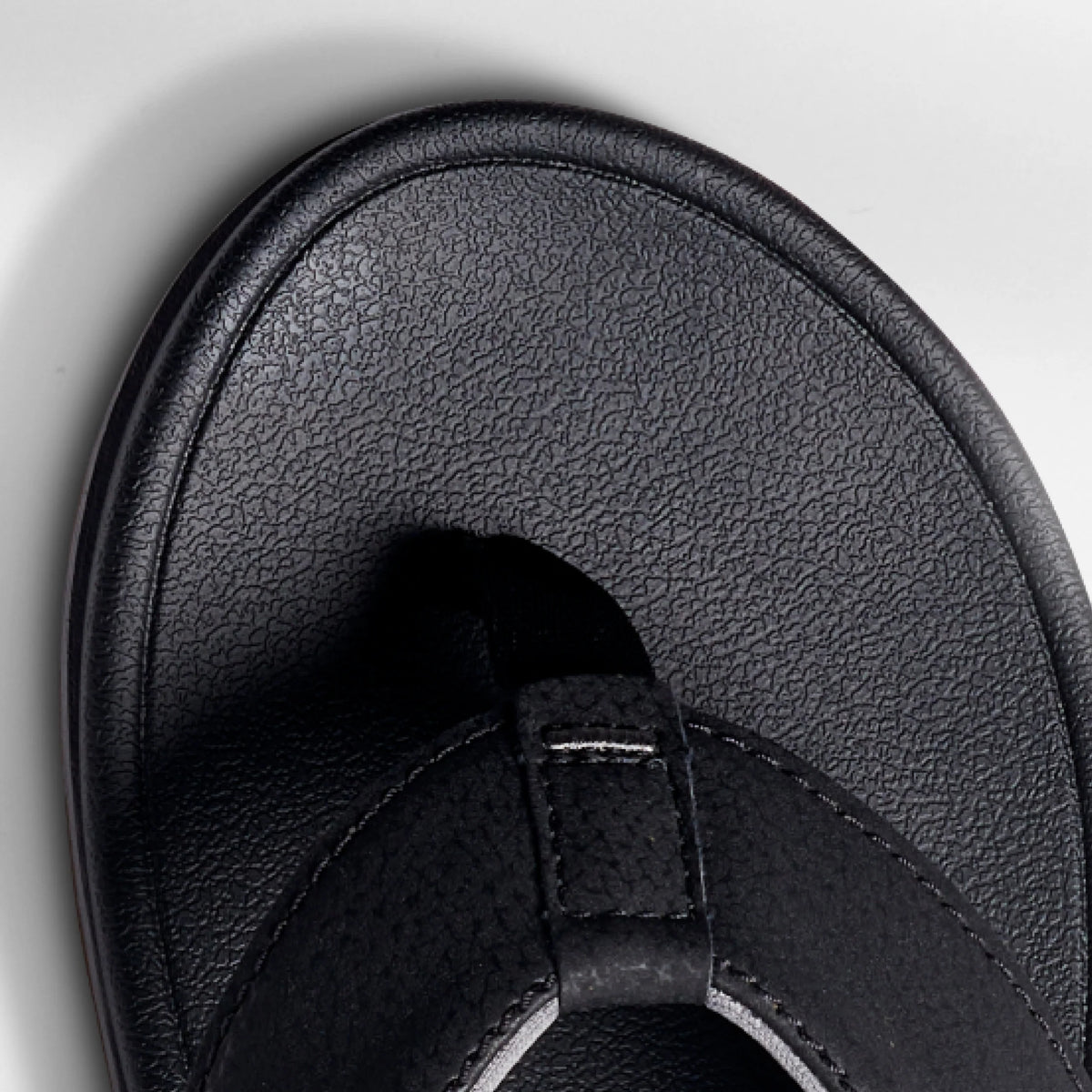 Close-up of the front toe area of the Phantom Bonzer men's black sandal, designed for beach comfort and durability.