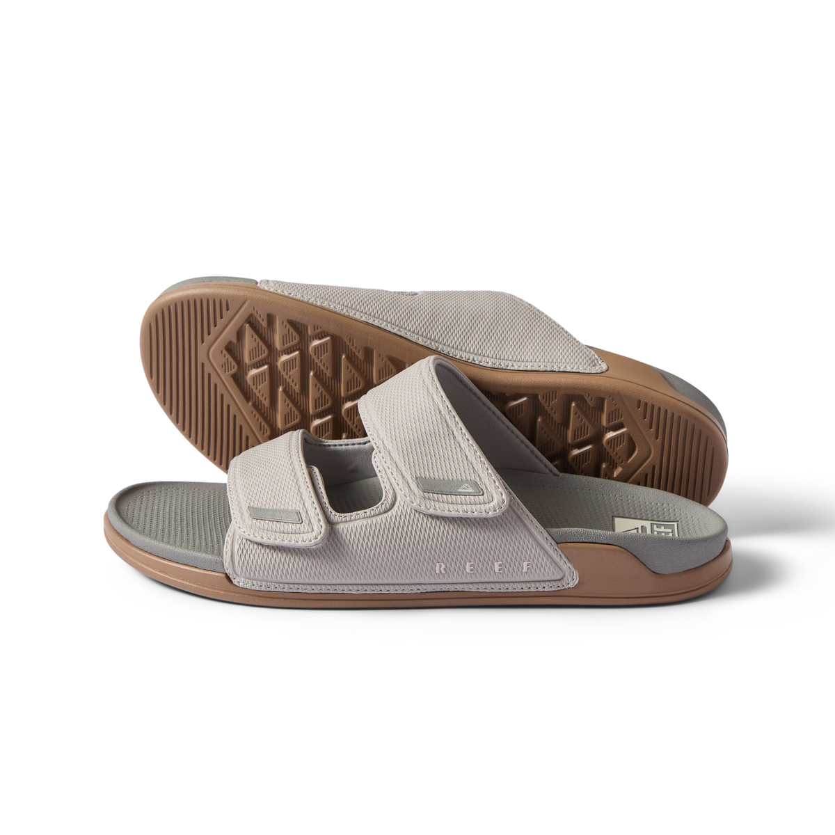 Pair of Phantom Tradewind men's sandals showing left side facing right with adjustable straps and cushioned sole in neutral tones
