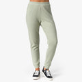 Front view of women's Tina Thermal Jogger in desert sage with sneakers, showcasing textured fabric and tapered ankle cuffs.