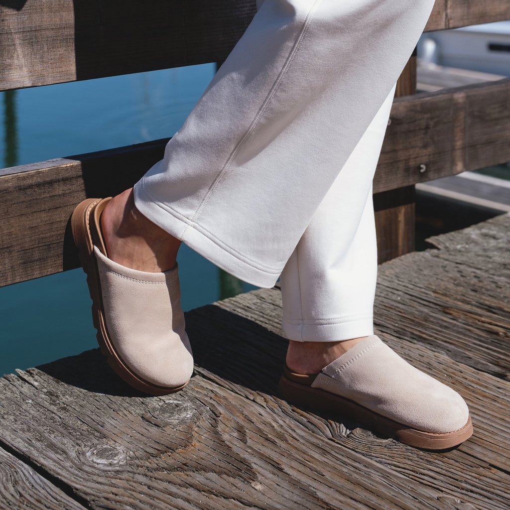 Vista Luxe Mariana facing left, women's light taupe suede clog with closed toe, cushioned arch support, and beach-inspired comfort